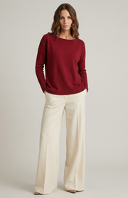Maglione a barchetta con trecce