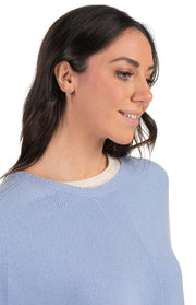 Poncho con frange in pelle