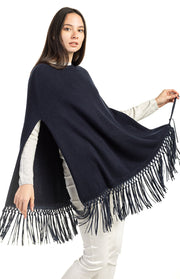Poncho con frange in pelle