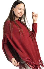 Poncho con frange in pelle