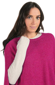 Poncho con frange in pelle