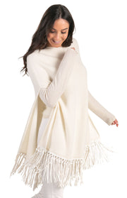 Poncho con frange in pelle